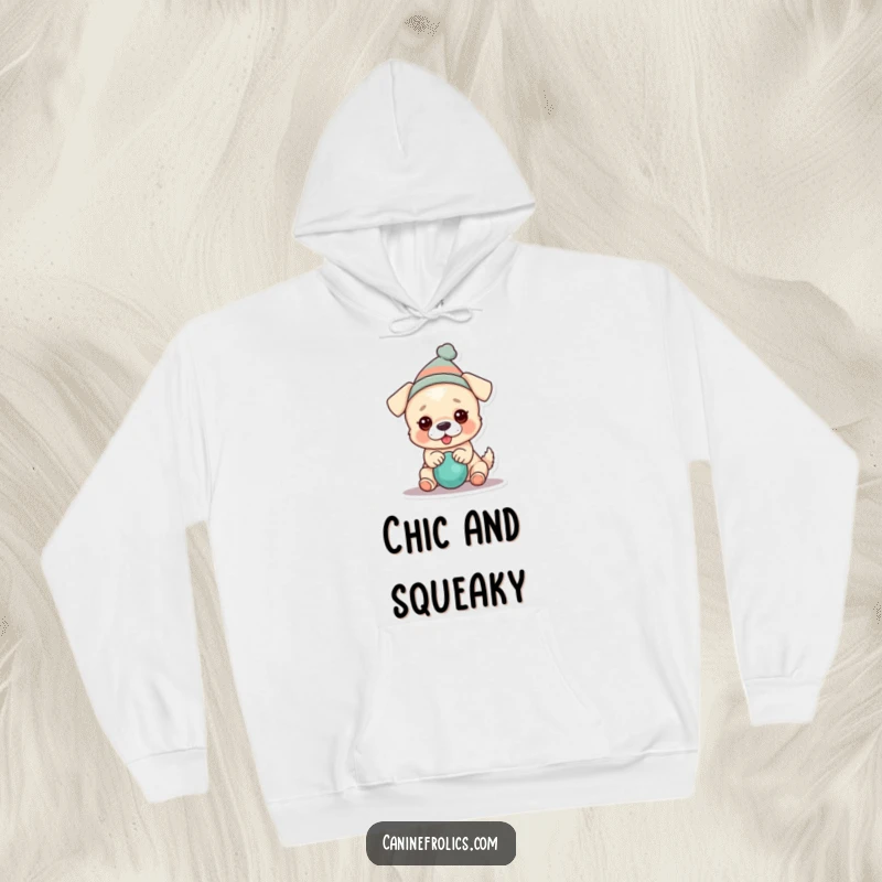 Funny dog hoodie showcasing a dog in a tiny hat, gleefully engaged with a squeaky toy, embodying playful abandon.