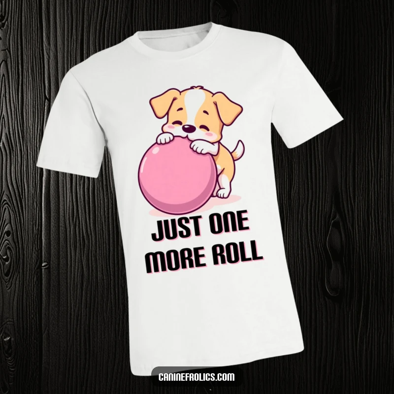 Funny dog t-shirt featuring a dog playfully nudging a massive rolling ball, embodying pure joy and active fun.